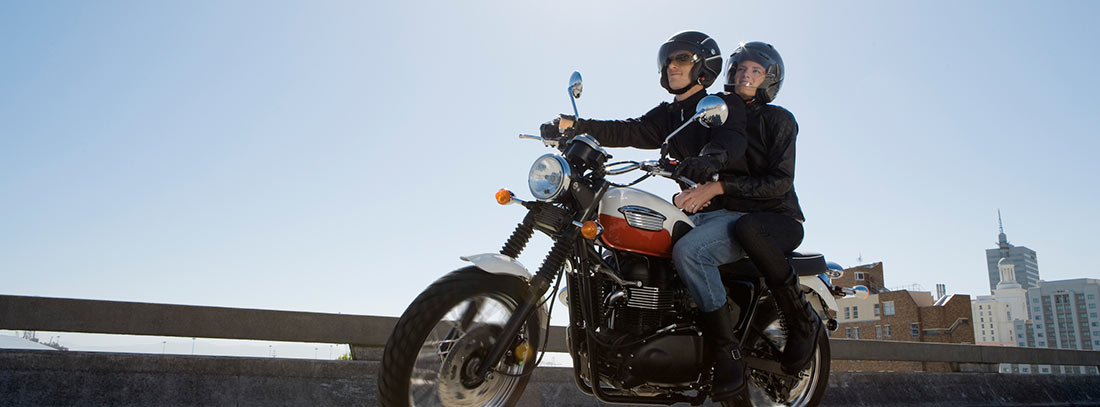 Couple riding a motorcycle