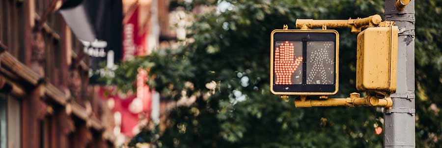Don't accept the first offer from Progressive Insurance after a motorcycle accident | image of a pedestrian stop sign colorado denver motorcycle accident attorney lawyer denver arvada aurora lakewood fort collins colorado springs