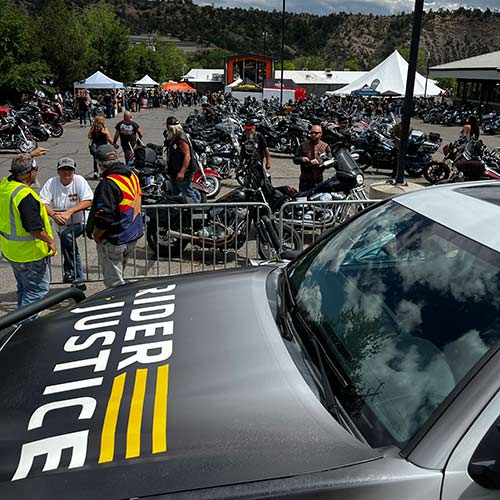 Rider Justice truck with many motorcycle riders