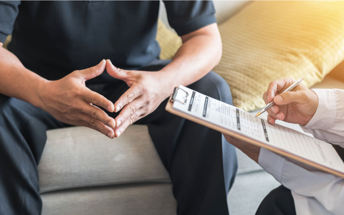 image person talking to doctor | motorcycle accident attorney denver