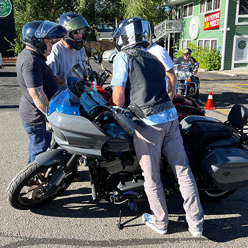 Motorcyclists having discussion before a ride