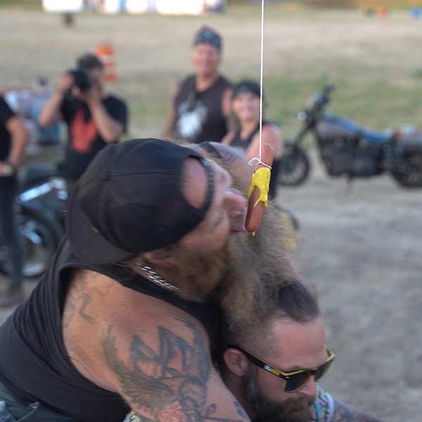 Dumptruck and Brady McLean compete in the Weenie Bite competition at Camp Zero |  | colorado motorcyle lawyers