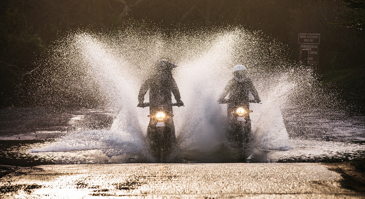 Ben Giese and Andrew Campo riding motorcycles through water