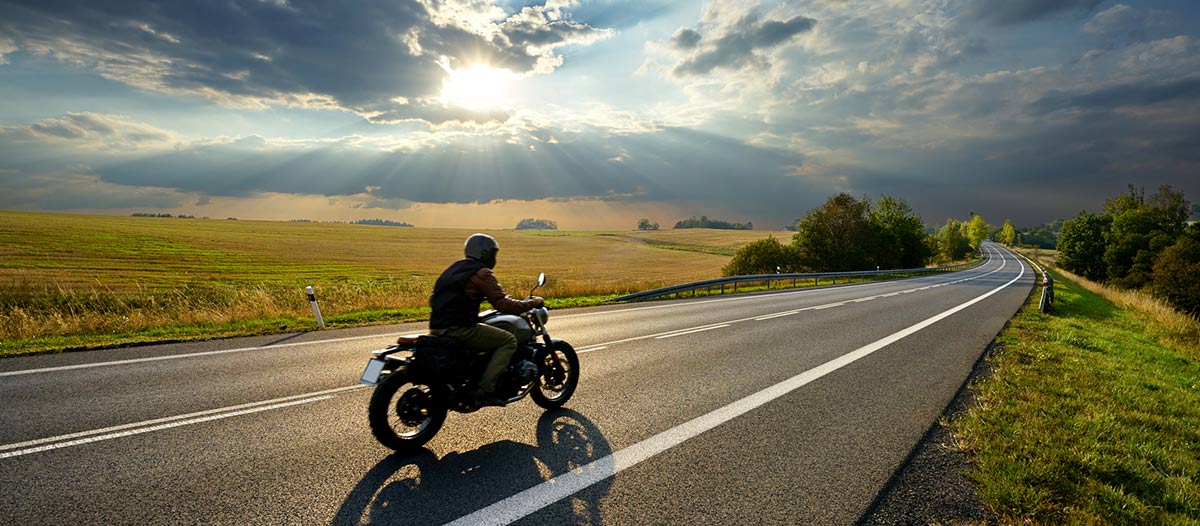 motorcyclist riding on an open road - a motorcycle accident lawyer explains where crashes most frequently happen