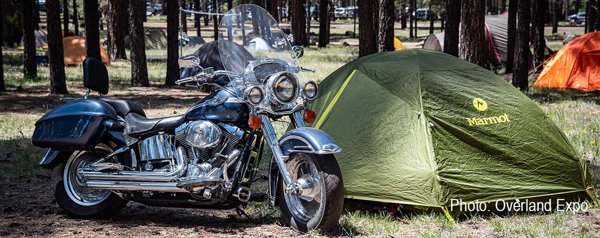 Motorcycle with Marmot tent camping at Overland Expo