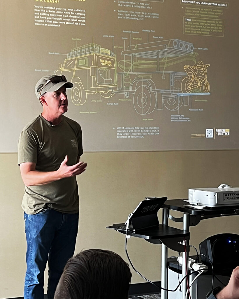 Scott presenting insurance information at Overland Expo