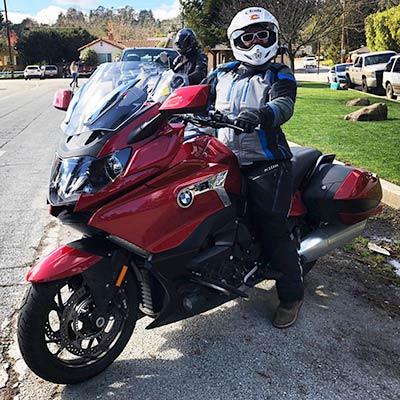 Kandi Spangler on red BMW motorcycle
