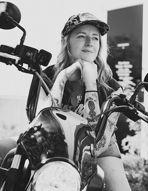 Woman sitting on her motorcycle