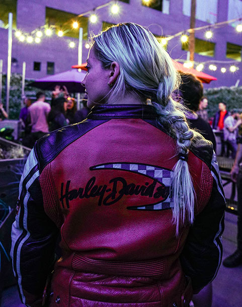 Woman rider wearing a Harley-Davidson leather jacket
